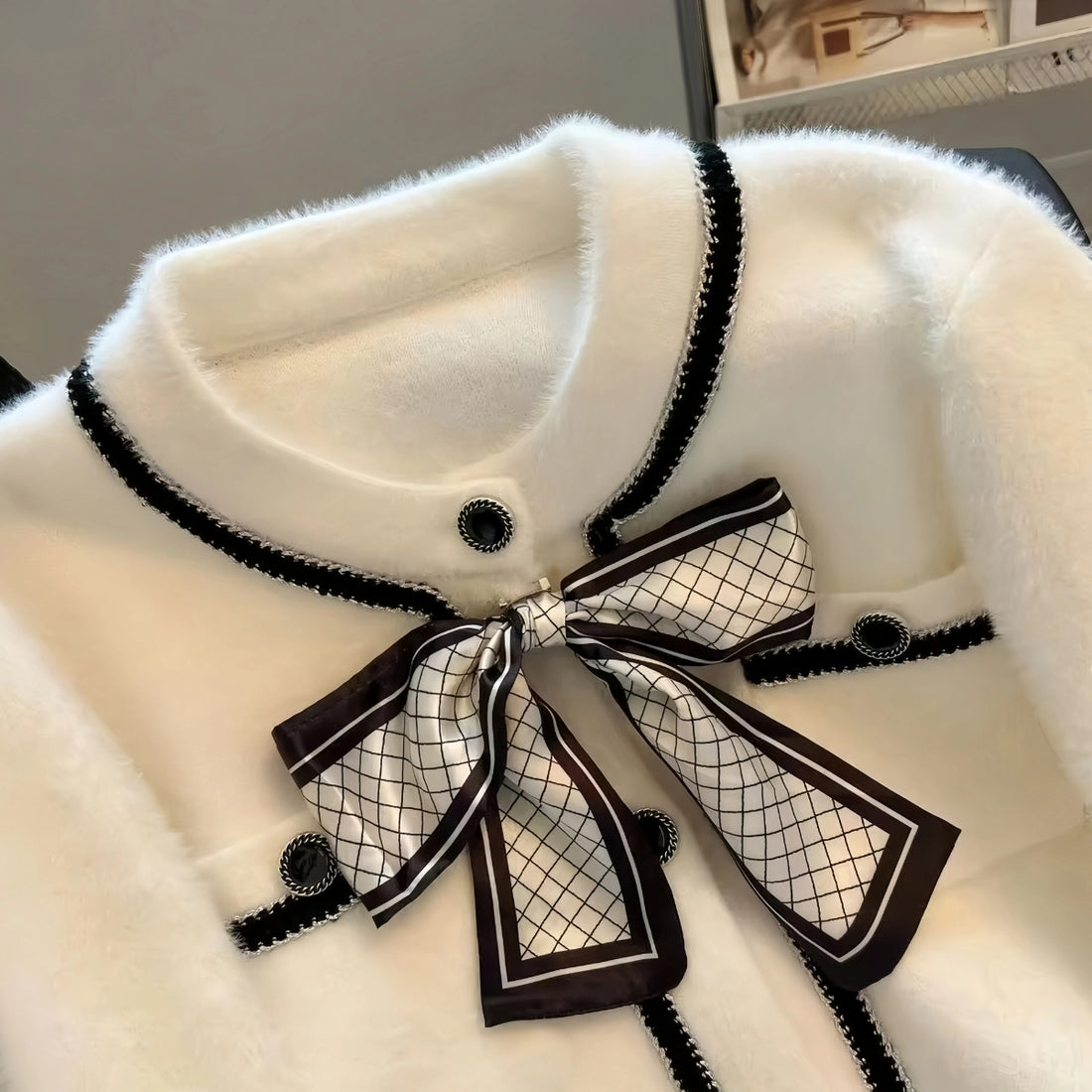 Elegant White Fuzzy Cardigan with Black Trim and Bow Accent|C-02